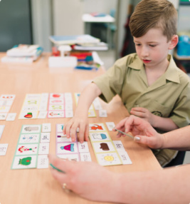 child with autism leaning difficulties getting learning support form an autism learning expert